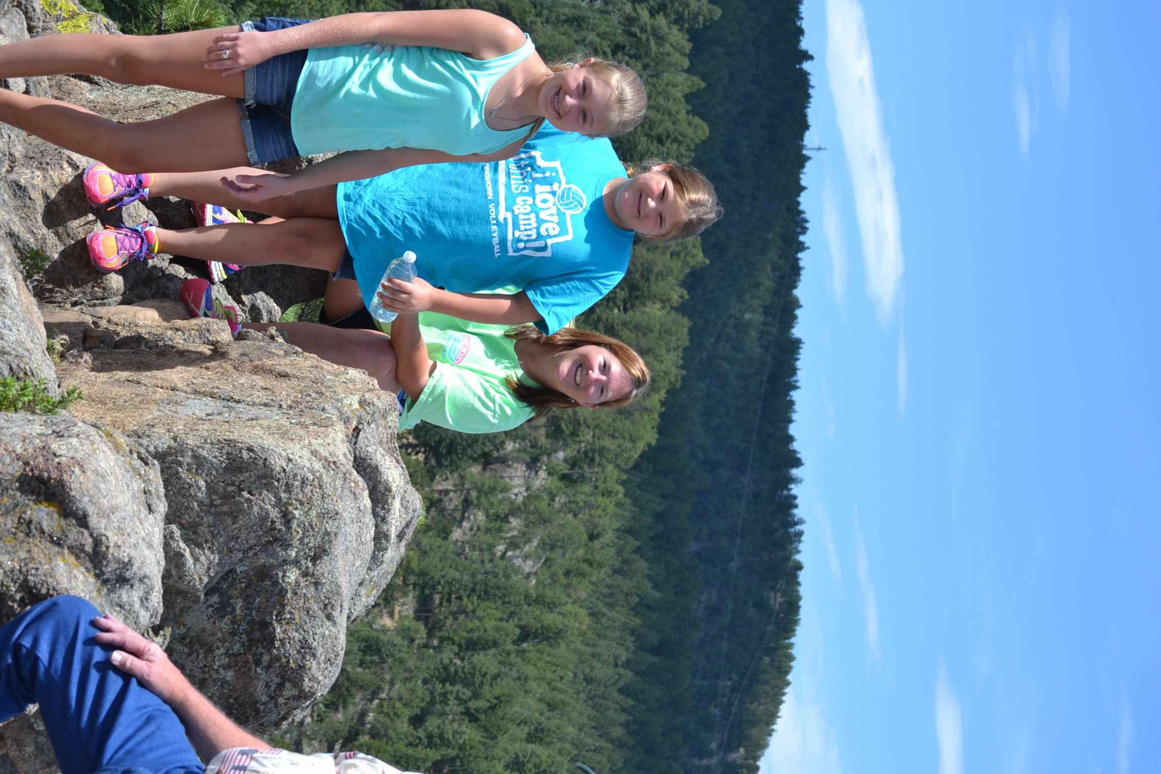 Bailey Schmitt and family on a hike with a mountain backdrop