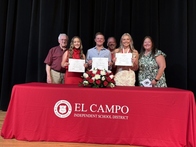 Three of the four Bailey Schmitt Memorial Fund scholarship recipients holding certificates with Len and family at the El Campo Independent School District awards ceremony